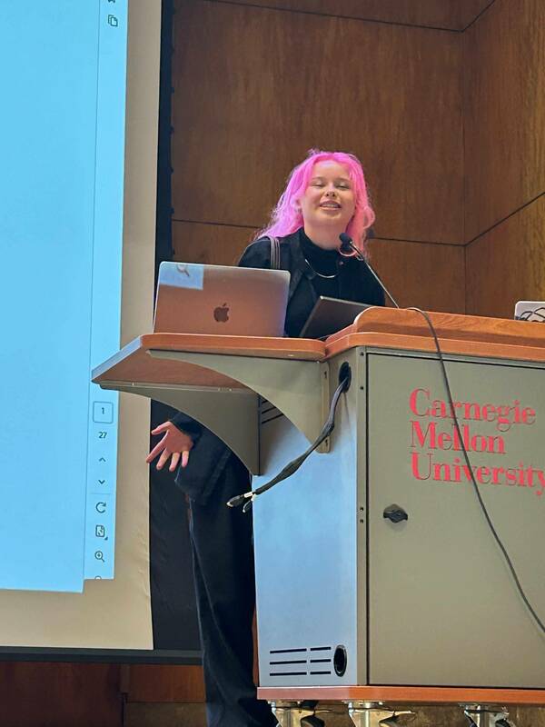 Lou Alvarado delivering her new member introduction at the in person CMU meeting.